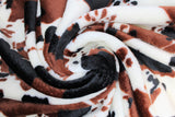 Swirled swatch animal print fleece in cow print (brown and black on white)