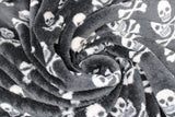 Swirled swatch white skull and crossbones on black fleece