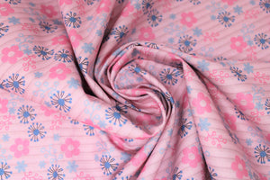 Group swatch assorted daisy printed fabrics in pink and aqua colours