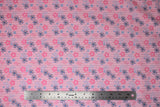 Flat swatch daisy printed fabric in pink (pink and blue daisies on light pink)