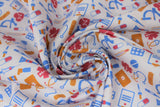 Swirled swatch doctor themed printed fabric in medical equipment (cartoon medical equipment in orange/pink/blue on white)
