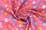 Swirled swatch doctor themed printed fabric in hospital heartbeat (white/orange/blue medical equipment and orange hearts with beats on pink)