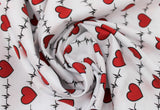 Swirled swatch hearts and heartbeat lines printed fabric on white (red hearts and black lines on white)