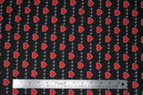 Flat swatch hearts and heartbeat lines printed fabric on black (red hearts and white lines on black)