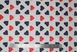 Flat swatch doctor themed printed fabric in tossed heartbeat (red and black hearts with hearbeat lines on white)