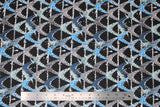 Flat swatch shark printed fabric in shark grunge (grey and blue open shark mouths tiled on black)
