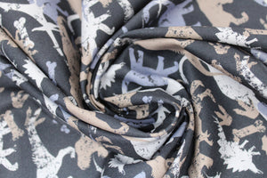 Group swatch assorted camo dinosaur printed fabrics in various styles