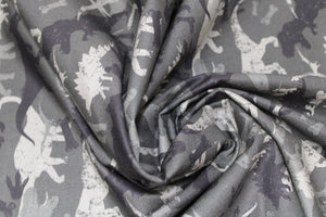 Group swatch assorted camo dinosaur printed fabrics in various styles