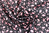 Swirled swatch Tossed Flamingos fabric (black fabric with tossed small pink flamingos allover)