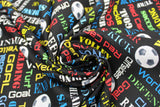 Swirled swatch Phrases fabric (black fabric with tossed soccer balls and packed words allover in various styles and directions and colours all related to soccer "Goal" "end line" etc)