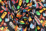 Swirled swatch Hero Toss fabric (black fabric with tossed full colour character names and heads tossed allover)