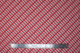 Flat swatch Marvel Brick fabric (red fabric with white 'MARVEL' logo allover in diagonal neat lines)