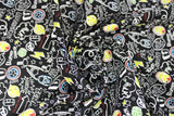 Swirled swatch licensed Avengers (Marvel) doodle style fabric in Doodle Iconography (multi head and logo white and pale colours on black)
