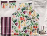 Full panel swatch vegetable apron (white apron with assorted vegetables and names text "Squash" etc. with purple/brown handles and pocket tops)