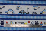 Flat swatch Stripe fabric (blue textured look fabric with thin white and light blue gingham stripes and thick white stripes with coloured cartoon style police related emblems and vehicles)