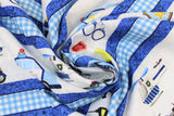 Swirled swatch Stripe fabric (blue textured look fabric with thin white and light blue gingham stripes and thick white stripes with coloured cartoon style police related emblems and vehicles)