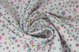 Swirled swatch stars fabric (white fabric with tossed pink, purple, blue, green, yellow, red stars in varying sizes and swoopy thin blue vein style lines in background)