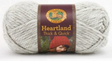 A ball of Lion Brand Heartland Thick & Quick in colourway Katmai (heathered light grey)