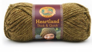 A ball of Lion Brand Heartland Thick & Quick in colourway Joshua Tree (heathered olive)
