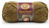 A ball of Lion Brand Heartland Thick & Quick in colourway Joshua Tree (heathered olive green)