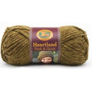 A ball of Lion Brand Heartland Thick & Quick in colourway Joshua Tree (heathered olive)
