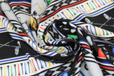 Swirled swatch Stripe fabric (golf themed horizontal stripes: white with coloured golf tees, black with crossed clubs, black white and grey argyle, etc.)