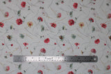 Flat swatch Tossed Flowers fabric (white fabric with loosely tossed white, red and yellow pale coloured floral with long stems and occasional butterfly on flower)