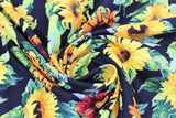 Swirled swatch Black Sunflowers fabric (black fabric with large tossed yellow, orange and red realistic look sunflowers)