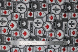 Flat swatch Canadian signs grey fabric (white fabric with tossed collaged Canadian badges and signs in white, black, grey with red accents "Canada", flags, Highway 1, etc.)
