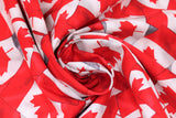 Swirled swatch tossed flags fabric (illustrative collaged Canadian flags tossed allover with grey in spaces)