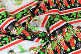 Swirled swatch Stripe fabric (horizontal christmas themed stripes black with red and green stockings, white stripes with snowmen, red and white thin separating stripes, holly graphics, etc.)