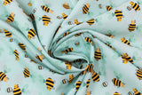 Swirled swatch teal bee fabric (pale teal/aqua fabric with cartoon yellow and black bees tossed allover)