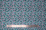 Flat swatch blue scales fabric (scalloped/scales pattern throughout in blues, teal, pink colourway)