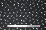 Flat swatch skulls fabric in black (black fabric with white small skull and crossbones tossed allover)
