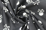 Swirled swatch skulls fabric in big (black fabric with big white skull and crossbones tossed allover)