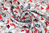 Swirled swatch Snowmen fabric (busy collaged cartoon style snowmen allover in black and red hats, white and red scarves)