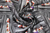 Swirled swatch Mummy! fabric (grey barn board pieces in various directions with red faced mummys poking their eyes and hands out)