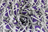 Swirled swatch Screaming Skeletons fabric (purple fabric with repeated skeleton top halves holding their heads and screaming repeated striped pattern)