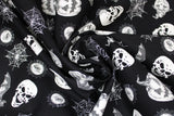 Swirled swatch Spooky Toss fabric (black fabric with tossed black and white spooky emblems allover: spiderwebs, skull heads, bats, jackolanterns, etc.)