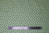 Flat swatch Wasabi fabric (pale green fabric with tossed dots and green Wasabi poufs allover)