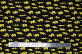 Flat swatch yellow fabric (black fabric with tossed yellow 3D drawing style lightning bolts)