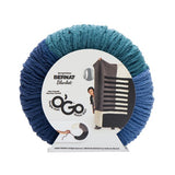 Blanket O'Go yarn ball in colourway Atlantic (dark teal, medium blue, dark blue sections) in packaging
