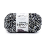 Ball of Bernat Blanket yarn in shade Inkwell (white, grey and black twisted strands)