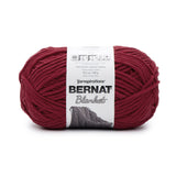 Ball of Bernat Blanket yarn in shade Crimson (deep dark red)