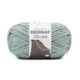 Ball of Bernat Blanket yarn in shade Smokey Green (pale medium green/grey)