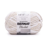 Ball of Bernat Blanket yarn in shade Beach Foam (white and cream shades)