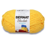 A ball of Bernat Blanket Brights in colourway School Bus Yellow