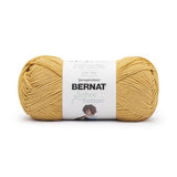 A ball of Bernat Softee Cotton yarn in shade Golden (faded gold yellow)