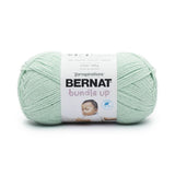 A ball of Bernat Bundle Up yarn in shade Green Mist (pale mint green)
