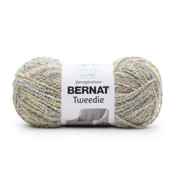 A ball of Bernat Tweedie yarn in shade summer rain (white/pale yellow/tan colourway with tweed like texture)